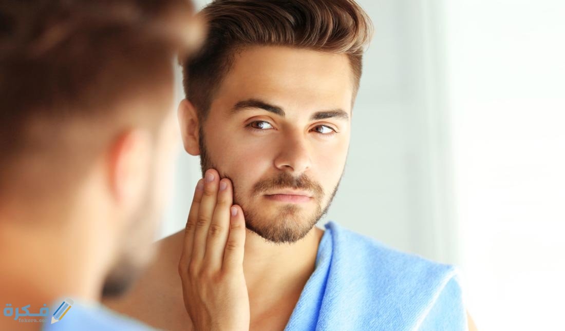 اسماء أنواع زيت الحشيش للذقن والشارب 1 looking at beard in mirror