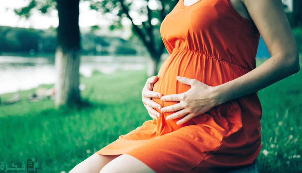 هل الاسهال عند الحامل في الشهر السابع خطير 1 orange dress pregnant 1170